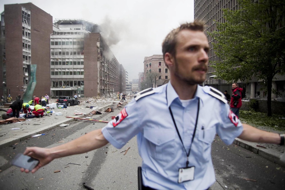 An official attempts to clear the street. 