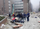 Injured people lay on the ground at the site of an explosion near the government buildings in Norway's capital Oslo earlier today (July 22, 2011). Injured people lay on the ground at the site of an explosion near the government buildings in Norway's capital Oslo earlier today (July 22, 2011).