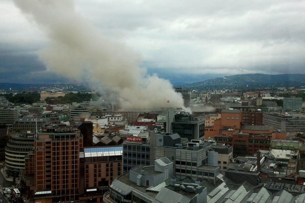 Smoke rises from the city center following the explosion. 
