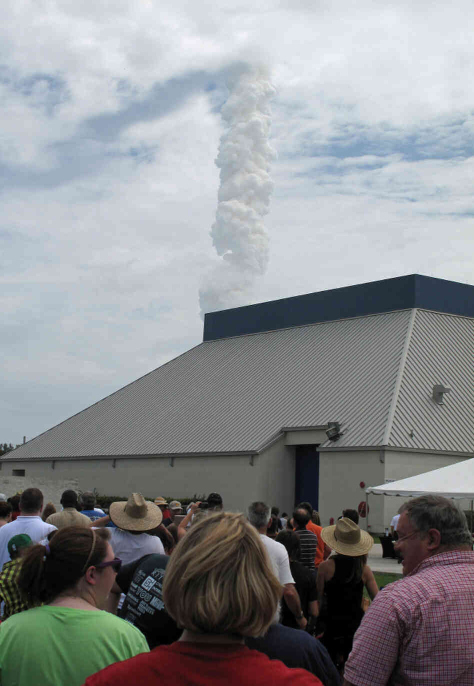 Atlantis quickly vanished into the clouds, leaving behind a massive column of thick smoke, and an audience in awe. Atlantis quickly vanished into the clouds, leaving behind a massive column of thick smoke, and an audience in awe.
