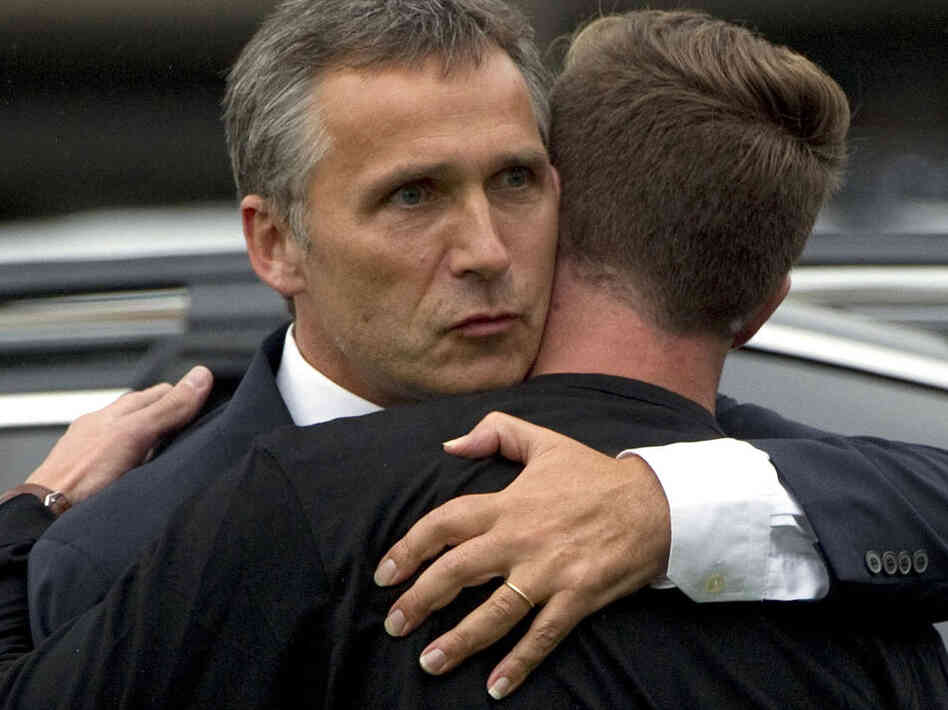 Norwegian Prime Minister Jens Stoltenberg (left) embraces  Eskil Pedersen, the leader of the Norwegian Labour Youth league and  survivor of the Utoya island shooting, at a hotel where survivors of  the youth camp attack are being reunited with their families in  Sundvolden.