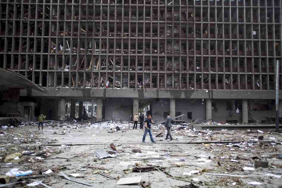 Debris covers the area outside a building that was rocked by the explosion. 