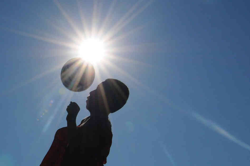 A member of the Salina South High School soccer team works out early Wednesday in Salina, Kan. 