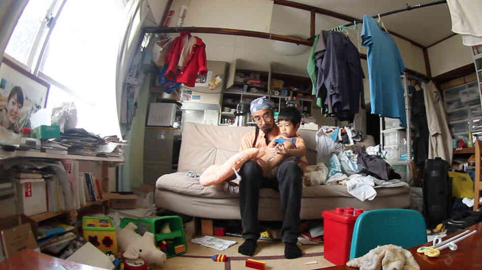 Hiroaki Aikawa and his son, Taiji, mourn the death of Hiroaki's wife, in Kevin Macdonald's Life in a Day, produced by Scott Free UK. Hiroaki Aikawa and his son, Taiji, mourn the death of Hiroaki's wife, in Kevin Macdonald's Life in a Day, produced by Scott Free UK.