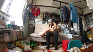 Hiroaki Aikawa and his son, Taiji, mourn the death of Hiroaki's wife, in Kevin Macdonald's Life in a Day, produced by Scott Free UK. Hiroaki Aikawa and his son, Taiji, mourn the death of Hiroaki's wife, in Kevin Macdonald's Life in a Day, produced by Scott Free UK.