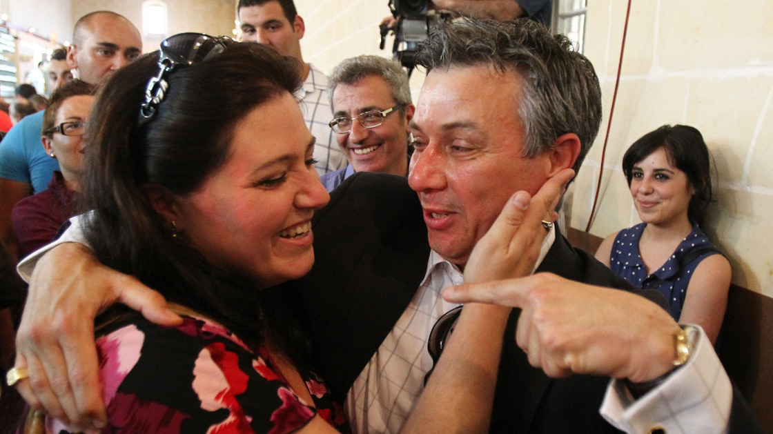 Nationalist MP Jeffrey Pullicino Orlando, right, celebrates the victory of the "yes" camp with yes movement chairman Deborah Schembri in the non-binding referendum to legalise divorce in Malta at a polling station in Valetta in May.
