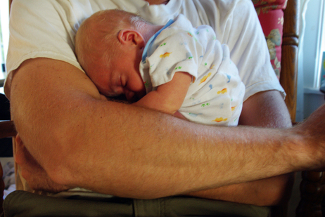 Finn sleeping in his dad's arms