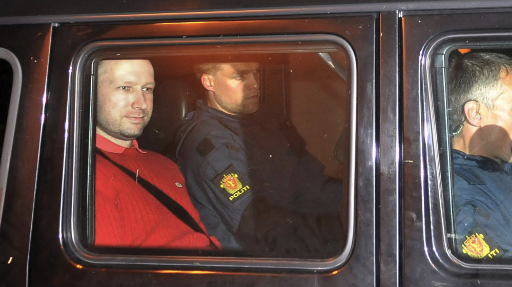 Anders Behring Breivik (left) exited an Oslo courthouse in an armored police vehicle following a hearing Monday at which he pleaded not guilty to one of the deadliest modern mass killings in peacetime.