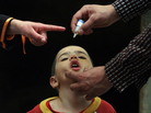 An Afghan health worker administers the polio vaccine to a child during a vaccination campaign in Kabul, Afghanistan, in 2010. An Afghan health worker administers the polio vaccine to a child during a vaccination campaign in Kabul, Afghanistan, in 2010.