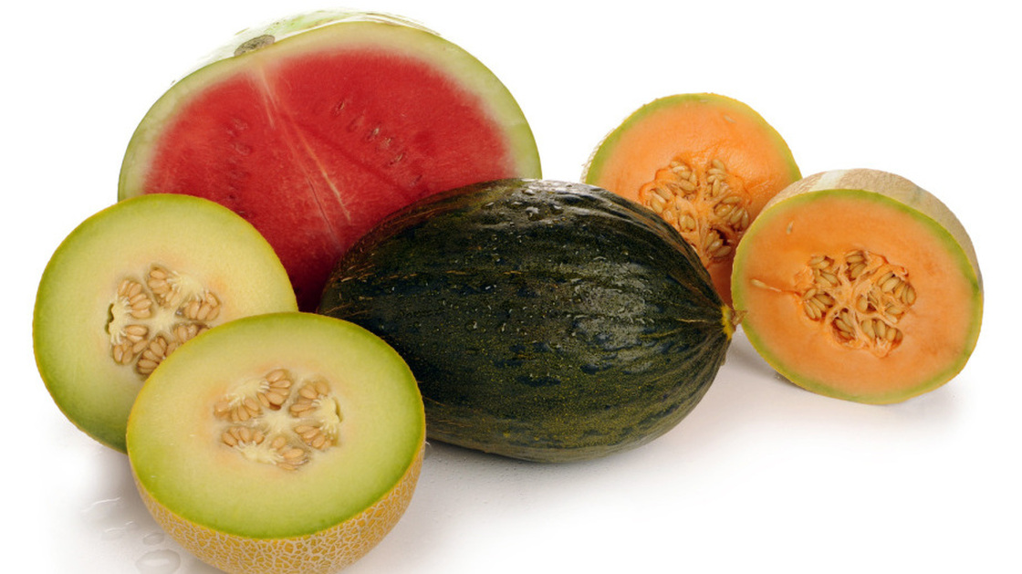 An assortment of melons, including watermelon and cantaloupe
