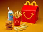 McDonald's cutting down on french fries and adding more healthful items, such as apple slices, to Happy Meals. McDonald's cutting down on french fries and adding more healthful items, such as apple slices, to Happy Meals.
