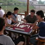 Michael Levy enjoys a game of Mahjiang with local youth.