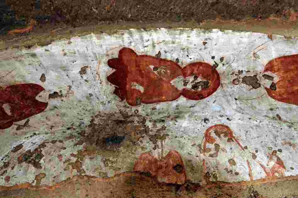 Damaged paintings at the top of the cave's entrance are shown in 2008. 
