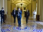 Senate Majority Leader Harry Reid on his cellphone as he walks to his office, July 27, 2011. Senate Majority Leader Harry Reid on his cellphone as he walks to his office, July 27, 2011.