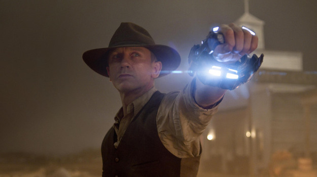 Bluest Hand In The West: Daniel Craig is the strong, silent type in Cowboys & Aliens, playing an mysterious outsider with a connection to the space invaders who have descended on the film's mining town. But his classic Western antihero can't defeat the film's cold, rote special effects.