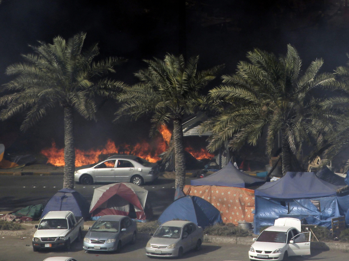Tents burn on March 16 as Bahraini security troops raid the site of a pro-democracy sit-in at Pearl Square, in the capital, Manama.