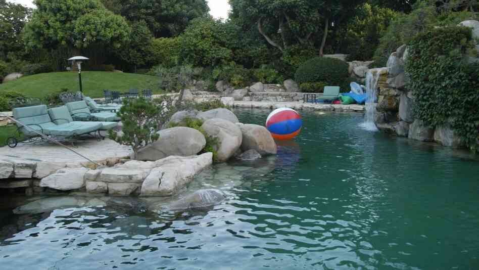 This shot of the Playboy Mansion pool and the outside of the grotto was taken in 2002. It looks very much the same now.