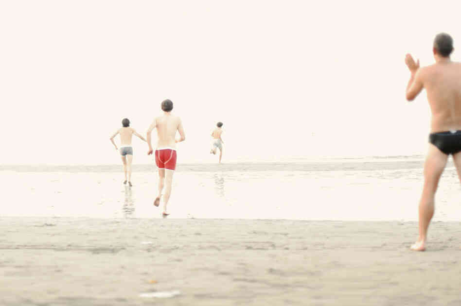 Young men stripped down to their underwear and ran into the water after the Festa del Redentore (Redentore Festival) in Venice, Italy. Young men stripped down to their underwear and ran into the water after the Festa del Redentore (Redentore Festival) in Venice, Italy.