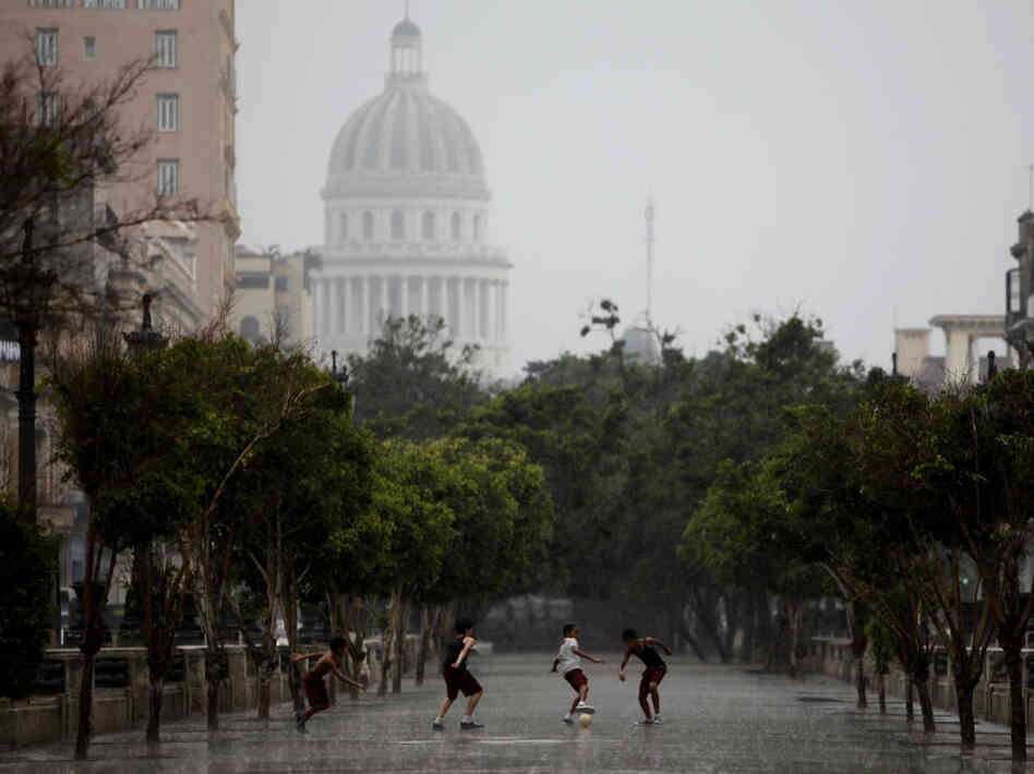Students play soccer along Prado Boulevard in Havana. The street also serves as a meeting place for property swaps. Students play soccer along Prado Boulevard in Havana. The street also serves as a meeting place for property swaps.