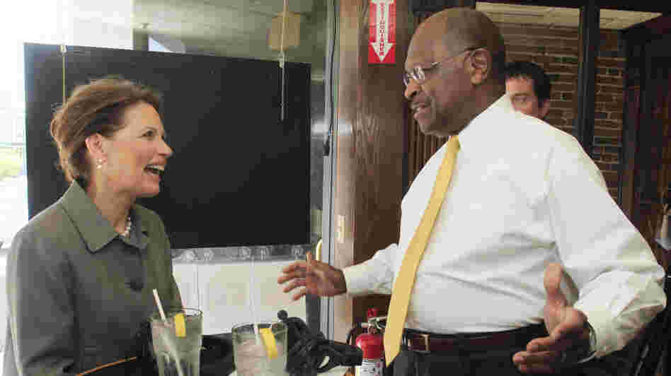 Presidential hopefuls Rep. Michele Bachmann (R-MN), who signed a pledge against abortion rights, and businessman Herman Cain, who has not, seen at the taping of a radio show in New Hampshire in May.