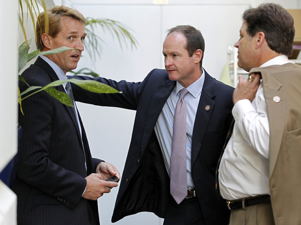 Republican congressmen Jeff Flake of Arizona, (l) a publicly announced "no" vote; John Sullivan of Oklahoma (c), and Bill Shuster of Pennsylvania, Wednesday, July 27, 2011.