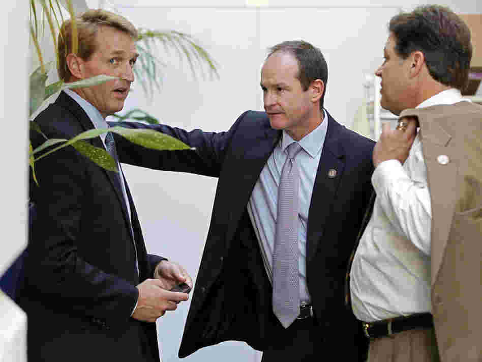 Republican congressmen Jeff Flake of Arizona, (l) a publicly announced "no" vote; John Sullivan of Oklahoma (c), and Bill Shuster of Pennsylvania, Wednesday, July 27, 2011.