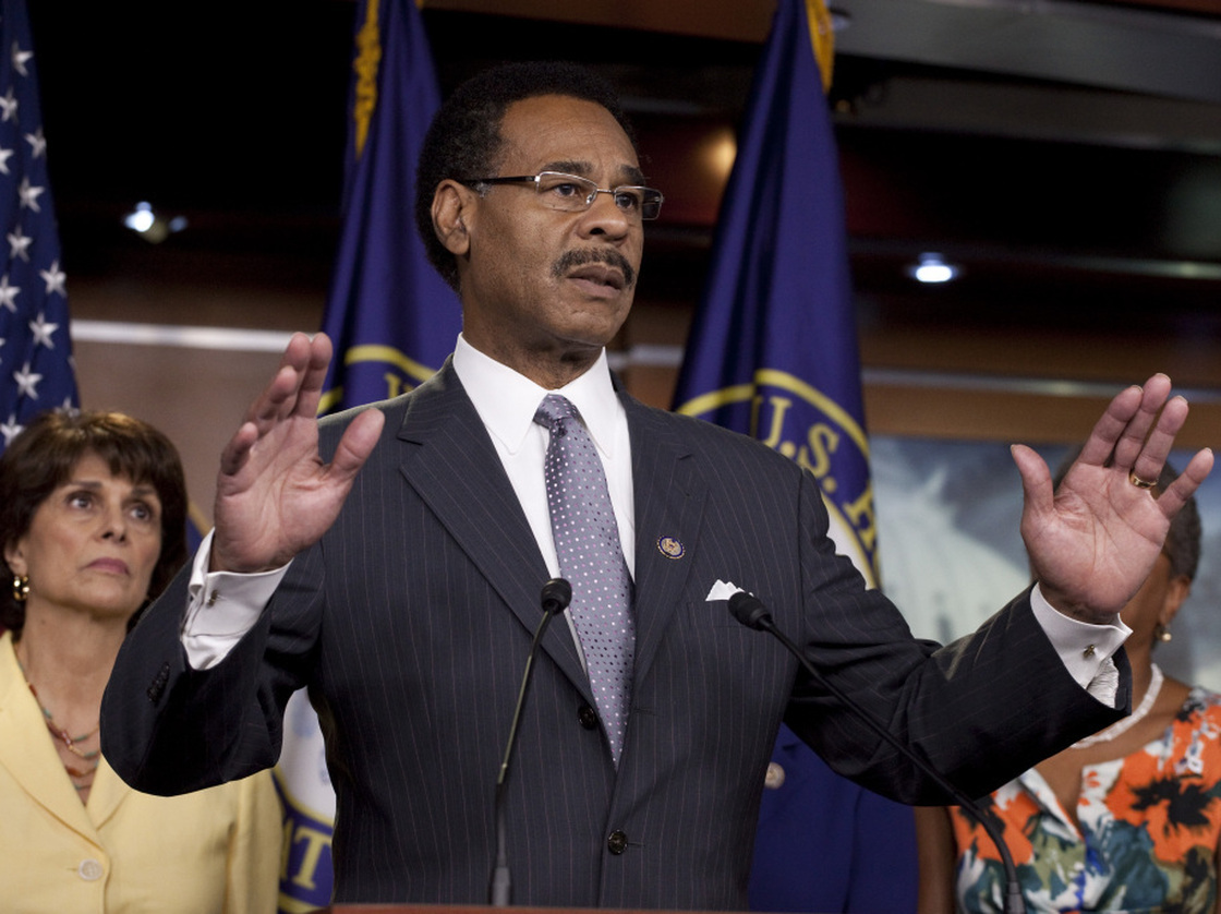 Rep. Emanuel Cleaver, D-Mo., leader of the Congressional Black Caucus, speaking on Capitol Hill in Washington on Wednesday, July 20, 2011. Rep. Lucille Roybal-Allard, D-Calif., listens at left.
