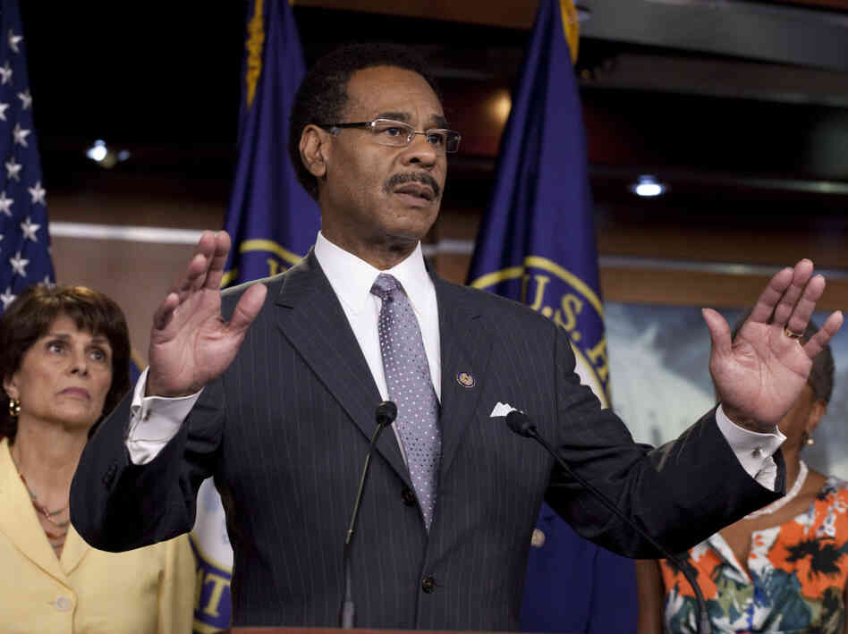 Rep. Emanuel Cleaver, D-Mo., leader of the Congressional Black Caucus, speaking on Capitol Hill in Washington on Wednesday, July 20, 2011. Rep. Lucille Roybal-Allard, D-Calif., listens at left.