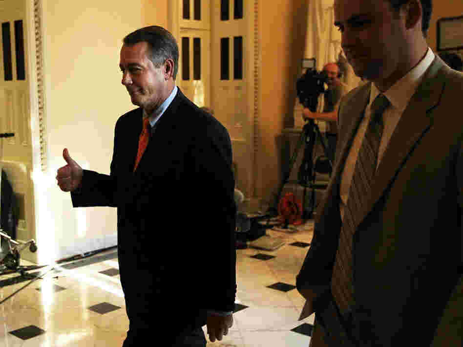 House Speaker John Boehner gives a thumbs up after the chamber passed his plan Friday to raise the debt ceiling and cut spending. The Senate voted to kill the measure a short time later.