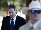 A law enforcement official stands by as Polygamist sect leader Warren Jeffs, left, arrives at the Tom Green County Courthouse on Thursday in San Angelo, Texas. Jeffs' much-anticipated Texas trial began on Thursday, with prosecutors claiming he sexually assaulted girls he manipulated into "spiritual marriage," and defense attorneys countering that their client's religious freedoms were trampled. A law enforcement official stands by as Polygamist sect leader Warren Jeffs, left, arrives at the Tom Green County Courthouse on Thursday in San Angelo, Texas. Jeffs' much-anticipated Texas trial began on Thursday, with prosecutors claiming he sexually assaulted girls he manipulated into "spiritual marriage," and defense attorneys countering that their client's religious freedoms were trampled.