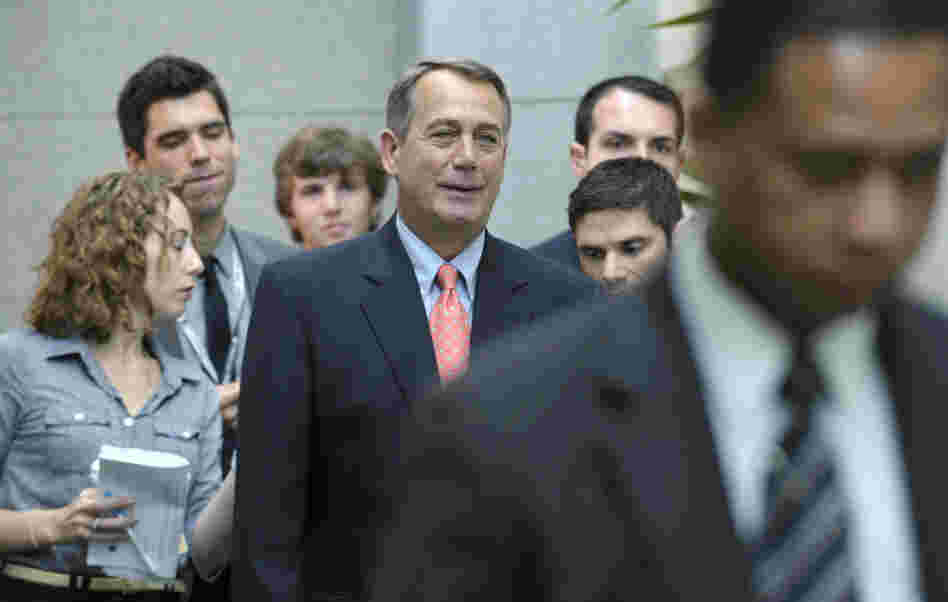 House Speaker John Boehner of Ohio walks to a caucus meeting on Capitol Hill in Washington.