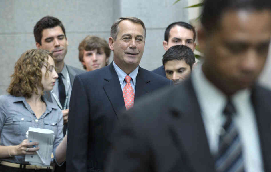 House Speaker John Boehner of Ohio walks to a caucus meeting on Capitol Hill in Washington.