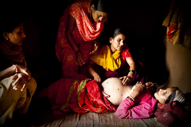 An aid worker examines Maheshwori and determines that her unborn baby is in a breech position. Because of the dangers associated with such a delivery, the aid worker makes a case to the village elders that a skilled birth attendant should be brought in to assist with the birth, rather than relying on an untrained traditional birth attendant.