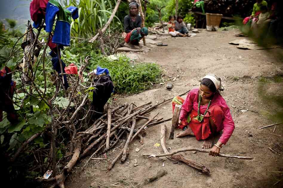 Despite being three days past due with her second child, Maheshwori continues to work chopping wood and herding goats, scratching out a living in Dikha Village, in the Himalayan foothills of Nepal. Her husband, who lives and works in neighboring India, comes home once a year.