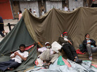 Anti-government protesters rest on their collapsed tent following clashes with the police as they called for the resignation of President Ali Abdullah Saleh in Sanaa, Yemen. Anti-government protesters rest on their collapsed tent following clashes with the police as they called for the resignation of President Ali Abdullah Saleh in Sanaa, Yemen.