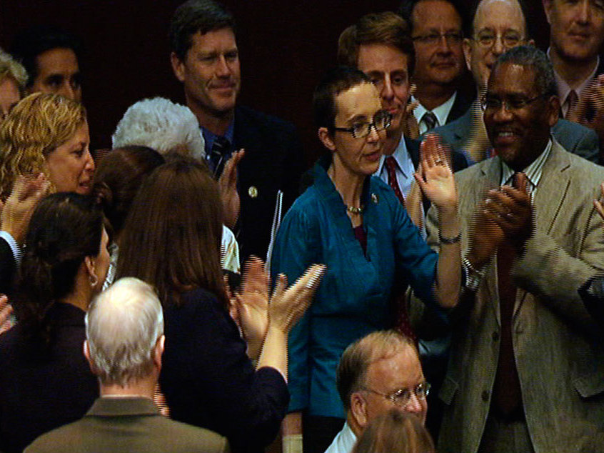In this image from House Television, Rep. Gabrielle Giffords, D-Ariz.,  appears on the floor of the House of Representatives for the first time since  her shooting earlier this year, attending a vote  on the debt standoff compromise.