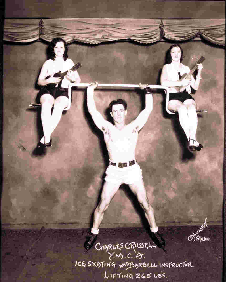 Physical instructor Charles Russell demonstrates his strength, May 18, 1939.