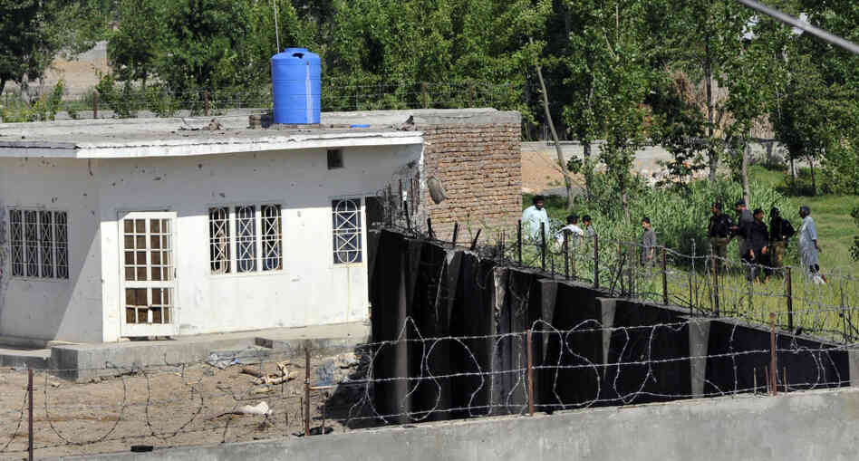 Policemen stand guard outside the compound used as a hideout by Osama bin Laden, the day after a U.S. raid killed the al Qaida leader in Abbottabad, Pakistan. Policemen stand guard outside the compound used as a hideout by Osama bin Laden, the day after a U.S. raid killed the al Qaida leader in Abbottabad, Pakistan.
