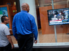 The House vote on raising the debt ceiling drew the interest of passers-by in New York. The bill will now head to the Senate, which is expected to vote on it Tuesday. The House vote on raising the debt ceiling drew the interest of passers-by in New York. The bill will now head to the Senate, which is expected to vote on it Tuesday.