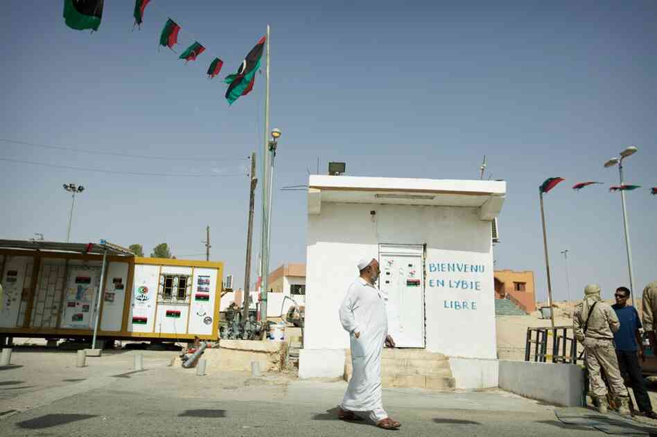 "I hope my pictures convey not just the creative use of weapons and vehicles, surreal surroundings, and the still high morale, but also the power of a popular uprising," Levinson says. Here, the Dahiba border crossing between Libya and Tunisia.