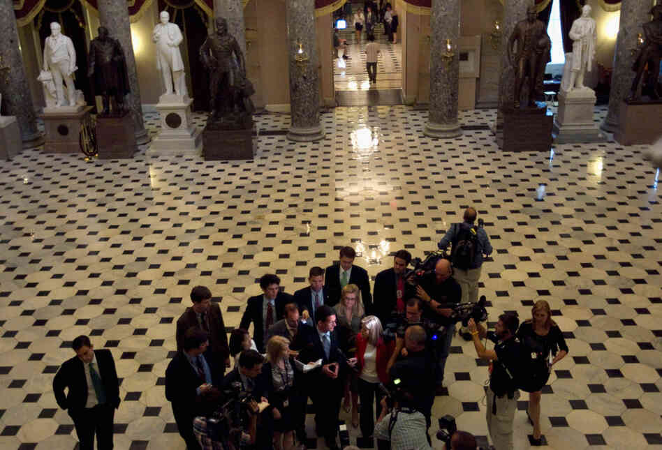 House Majority Leader Eric Cantor (R-VA) speaks with reporters after the House voted to raise the debt ceiling.