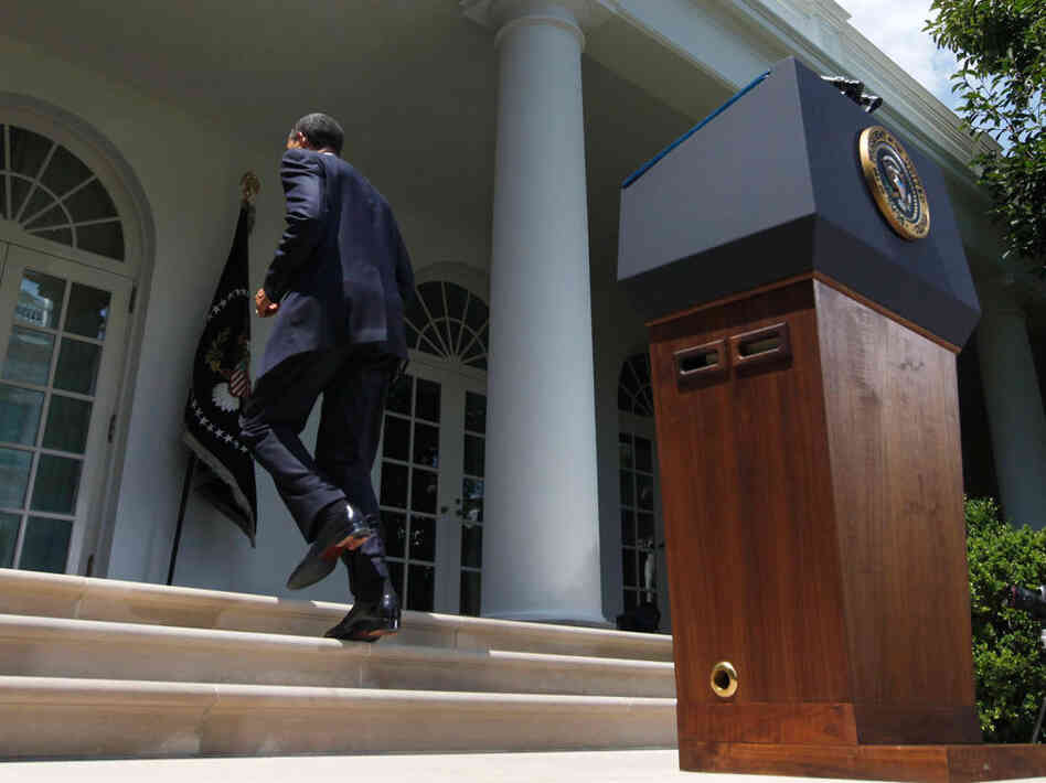 President Obama walks back to the Oval  Office after speaking about the Senate's passage of debt-ceiling legislation, at the White House on Tuesday.