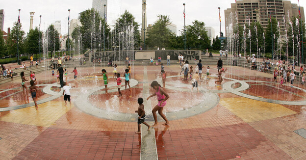 Children play in the fountain in Centennial Olympic Park in Atlanta in July 2006, 10 years after the city hosted the Olympic Games.