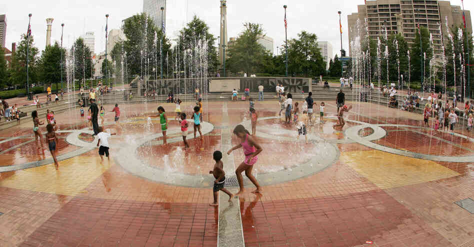 Children play in the fountain in Centennial Olympic Park in Atlanta in July 2006, 10 years after the city hosted the Olympic Games.