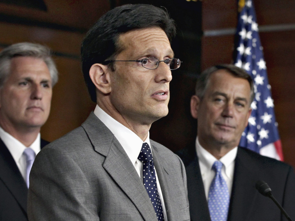 From left to right, House Majority Whip Kevin McCarthy, House Majority Leader Eric Cantor, and House Speaker John Boehner speaks to reporters about the debt crisis showdown during a news conference on Capitol Hill in Washington.