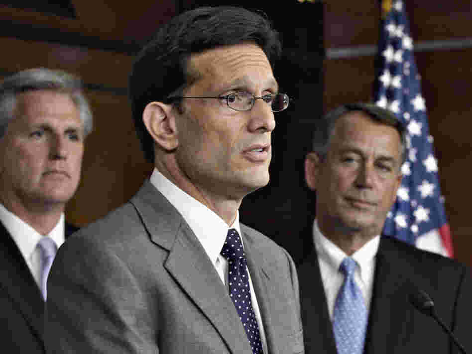 From left to right, House Majority Whip Kevin McCarthy, House Majority Leader Eric Cantor, and House Speaker John Boehner speaks to reporters about the debt crisis showdown during a news conference on Capitol Hill in Washington.