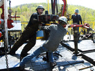 Workers move a section of well casing into place at a natural gas drilling rig near Burlington, Pa. The industry is expected to drill as many as 10,000 new wells in the next few years. Workers move a section of well casing into place at a natural gas drilling rig near Burlington, Pa. The industry is expected to drill as many as 10,000 new wells in the next few years.
