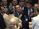 Rep. Gabrielle Giffords (D-AZ), center, is welcomed by her fellow members of the the House of Representatives as she appears on the floor for the first time since her shooting earlier this year. Rep. Gabrielle Giffords (D-AZ), center, is welcomed by her fellow members of the the House of Representatives as she appears on the floor for the first time since her shooting earlier this year.