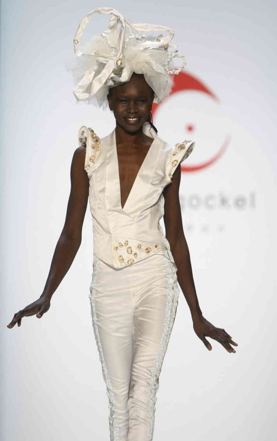 Sudan-born model Alek Wek displays a creation by German fashion designer Anja Gockel, at the Fashion Week in Berlin, Germany, Thursday, Jan. 21, 2010.