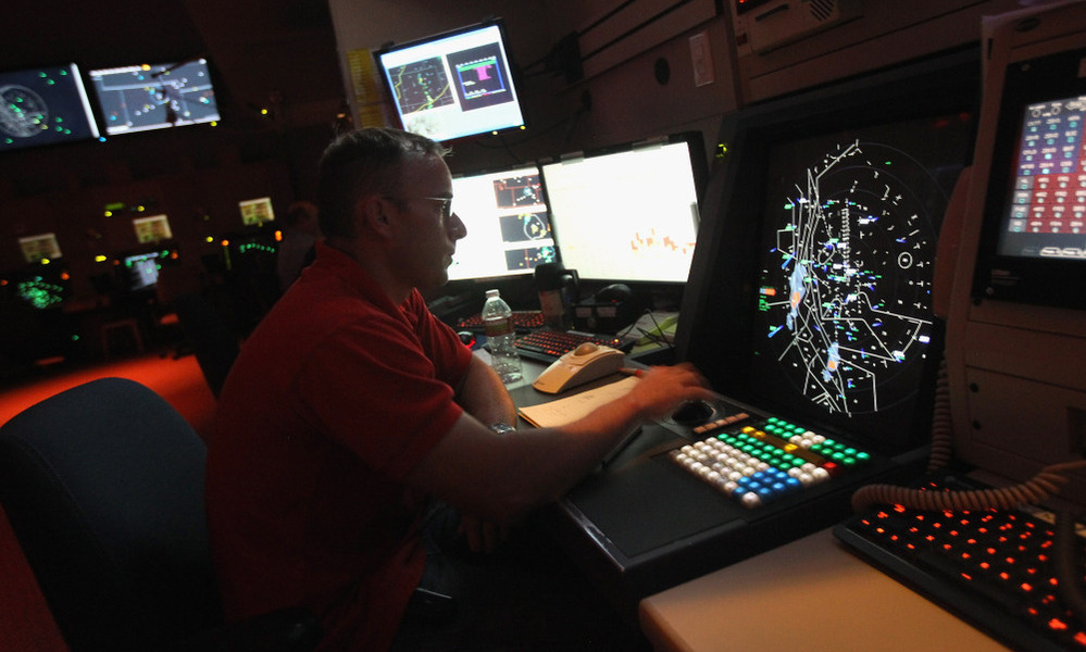 The FAA's partial shutdown doesn't affect air traffic controllers (above). But the impasse has left some 47,000 workers without a paycheck.